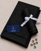Black Italian Boski suiting fabric roll with Rana Fabrics ribbon, buttons, and premium quality tag for formal wear