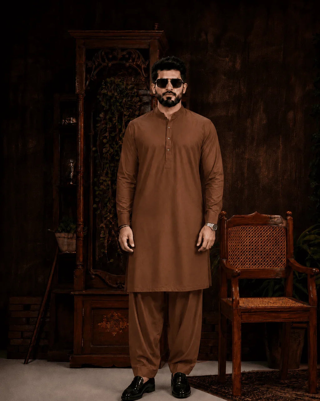 Men's brown unstitched suiting fabric for formal wear, styled with matching shalwar and black loafers