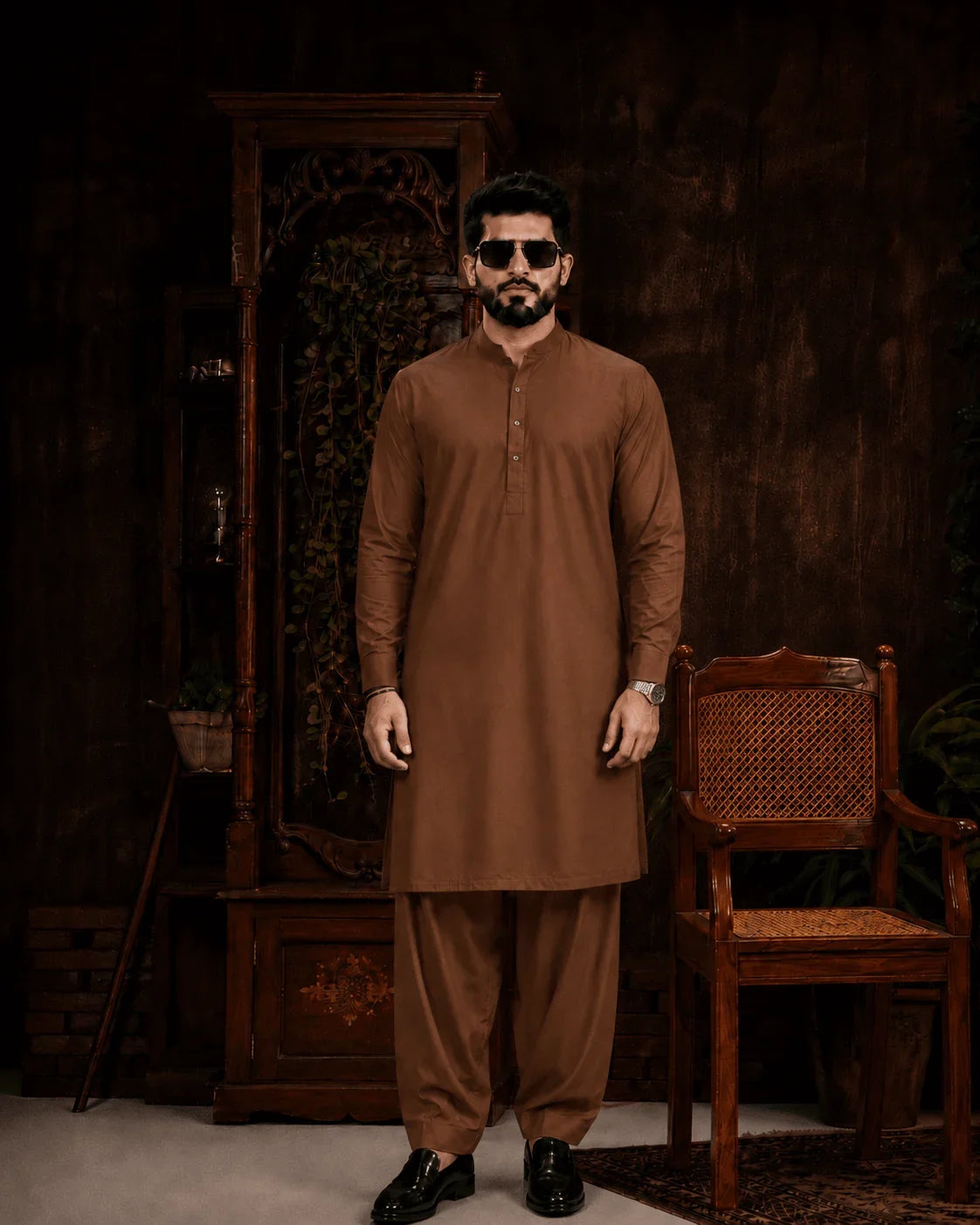 Men's brown unstitched suiting fabric for formal wear, styled with matching shalwar and black loafers
