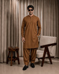 Men's brown unstitched suiting fabric set for formal and festive wear, featuring a kurta and shalwar