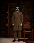 Men's olive green unstitched suiting fabric for formal and festive wear, styled with matching shalwar and loafers