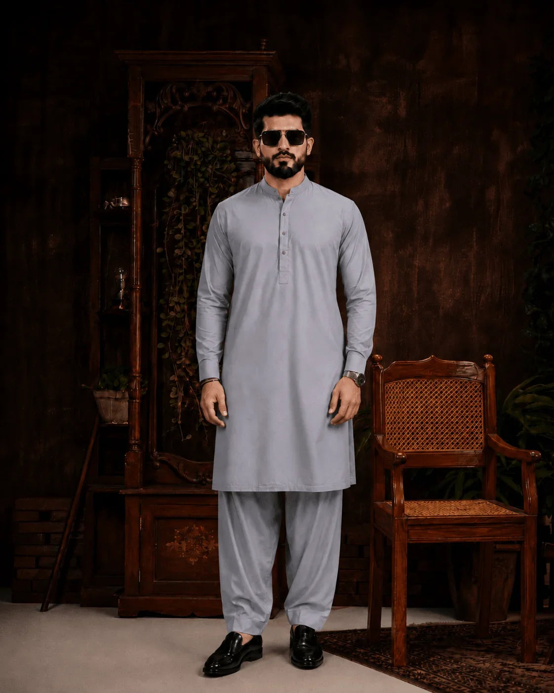 Man in light gray unstitched suiting fabric kurta and shalwar, ideal for formal or festive wear