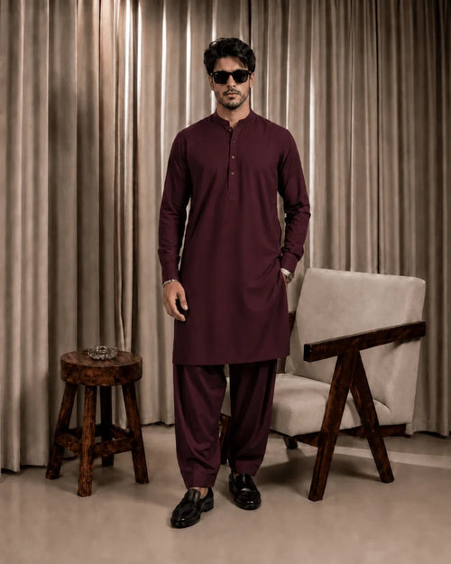 Man in maroon unstitched suiting fabric outfit, formal wear for festive occasions