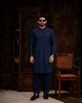 Man in navy blue unstitched suiting fabric kurta and shalwar, ideal for formal or festive wear