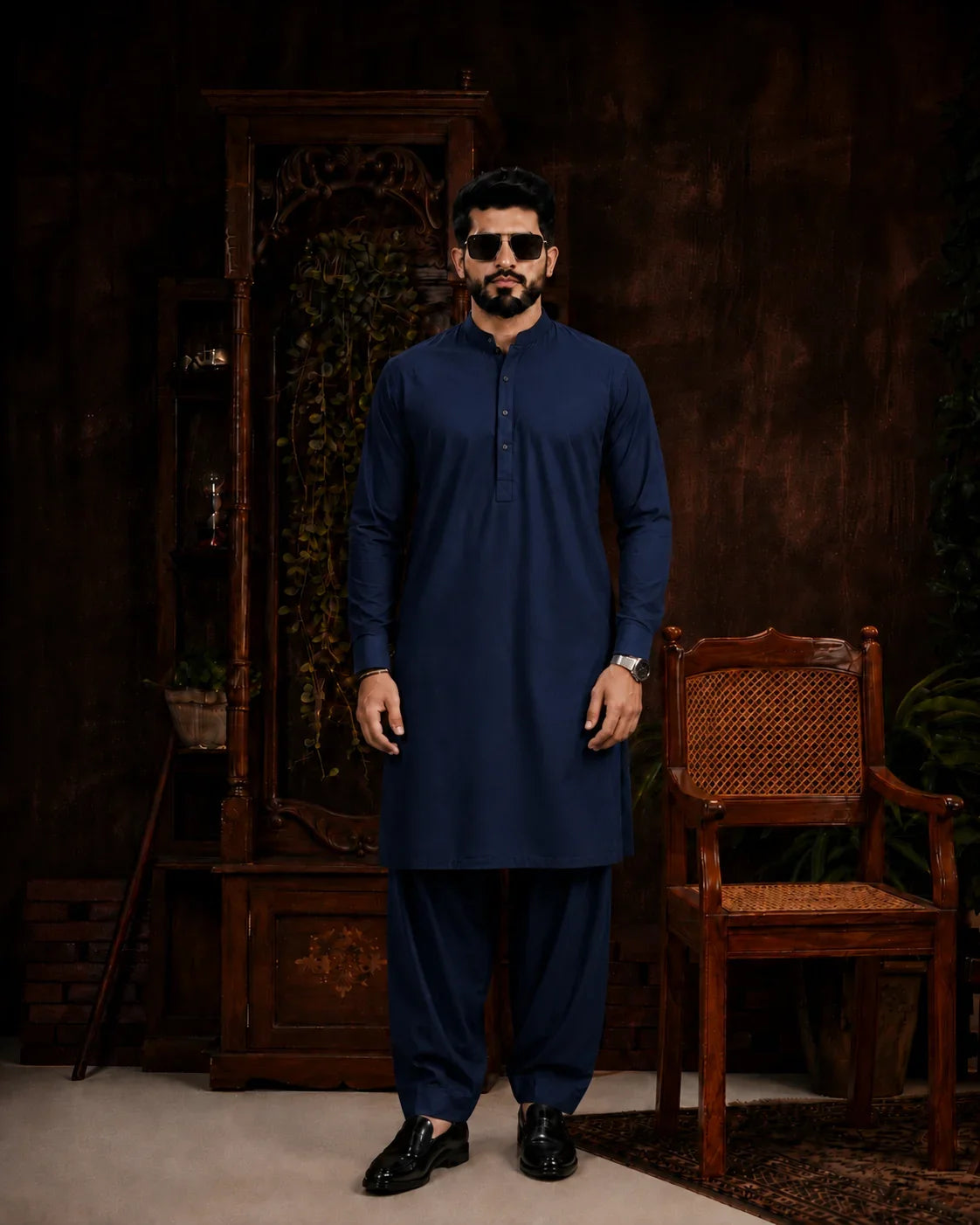 Man in navy blue unstitched suiting fabric kurta and shalwar, ideal for formal or festive wear
