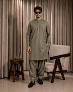 Olive green men's shalwar kameez in premium suiting fabric, ideal for formal and festive occasions