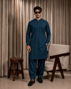 Man in teal unstitched suiting fabric kurta and shalwar, ideal for formal or festive wear