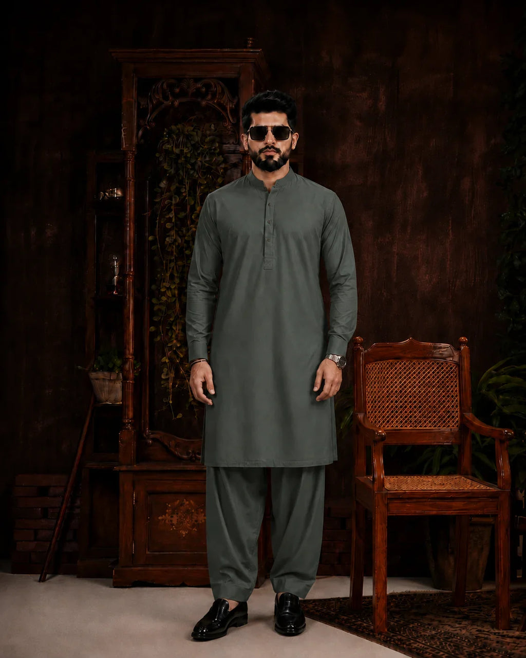 Men's olive green unstitched suiting fabric for formal and festive wear, paired with matching trousers.
