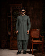 Men's olive green unstitched suiting fabric for formal and festive wear, paired with matching trousers.