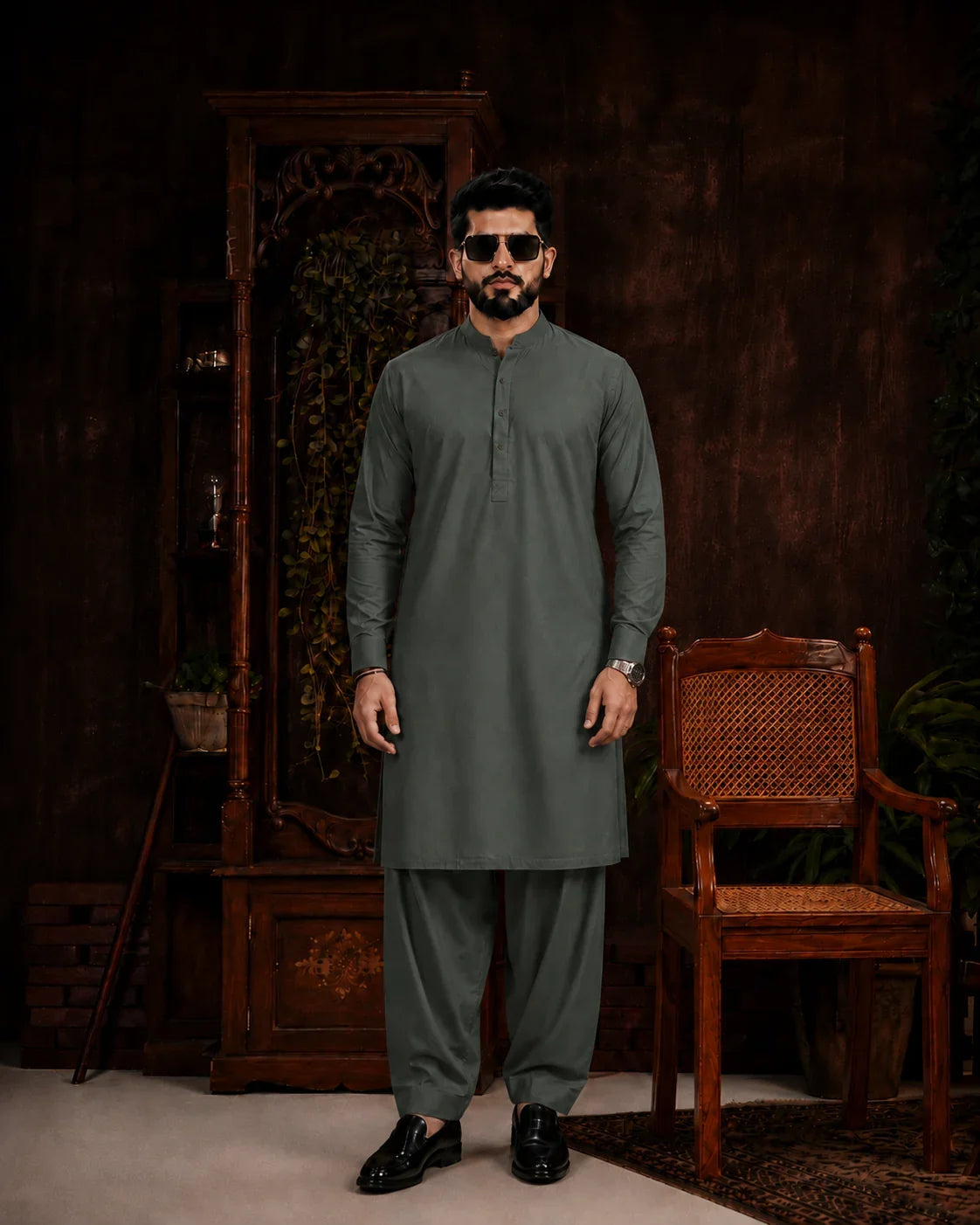 Men's olive green unstitched suiting fabric for formal and festive wear, paired with matching trousers.