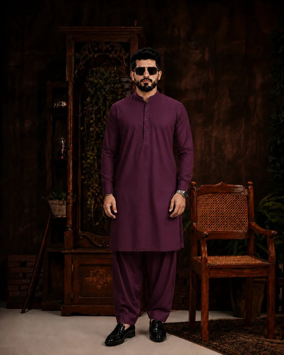 Man in purple unstitched suiting fabric kurta and shalwar, ideal for formal or festive wear