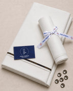 Premium Italian Boski men's suiting fabric, neatly folded with branded ribbon and buttons for formal wear.
