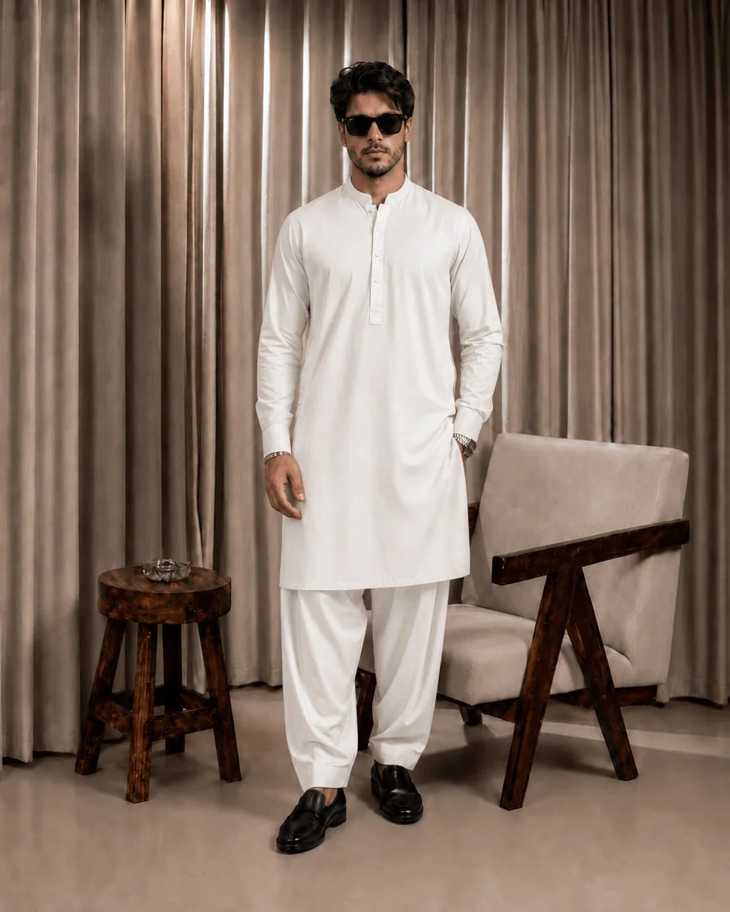 Man in white shalwar kameez, formal men's unstitched suit fabric, ideal for business or festive occasions